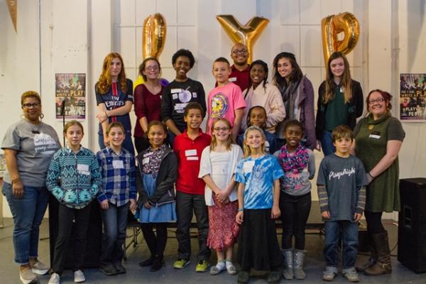 A PYP Pep Rally featuring student participants, PYP staff, and gold PYP balloons